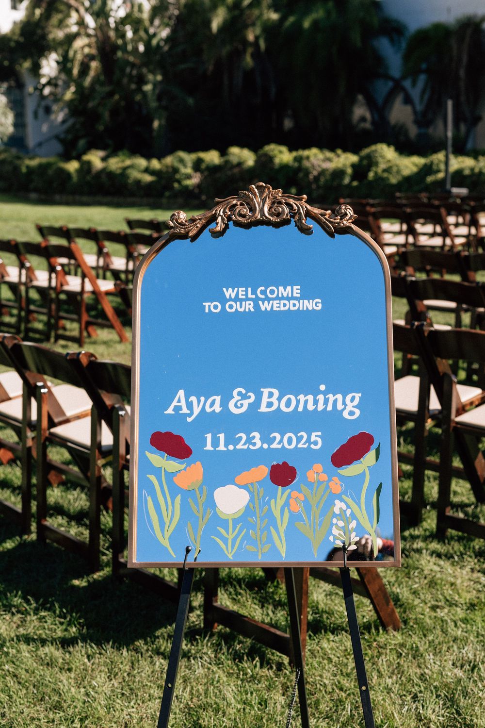 A wedding sign featuring the couples names for a wedding ceremony in the Santa Barbara Courthouse Sunken Gardens