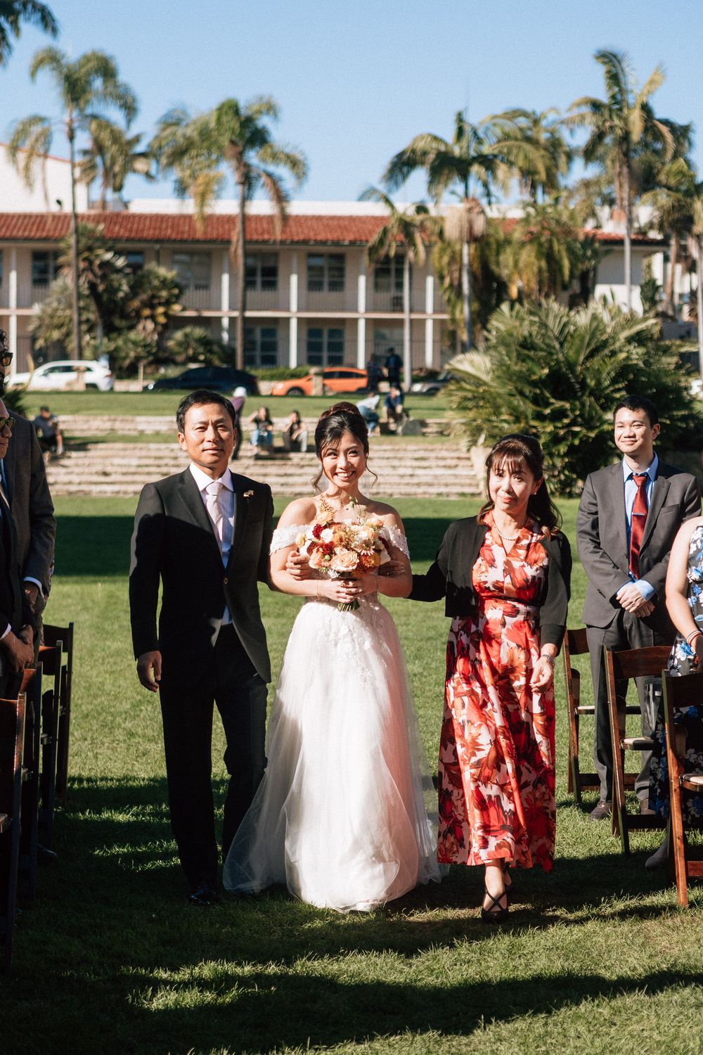 A bride walks down the aisle at the Sunken Gardens venue at the Santa Barbara Courthouse.
