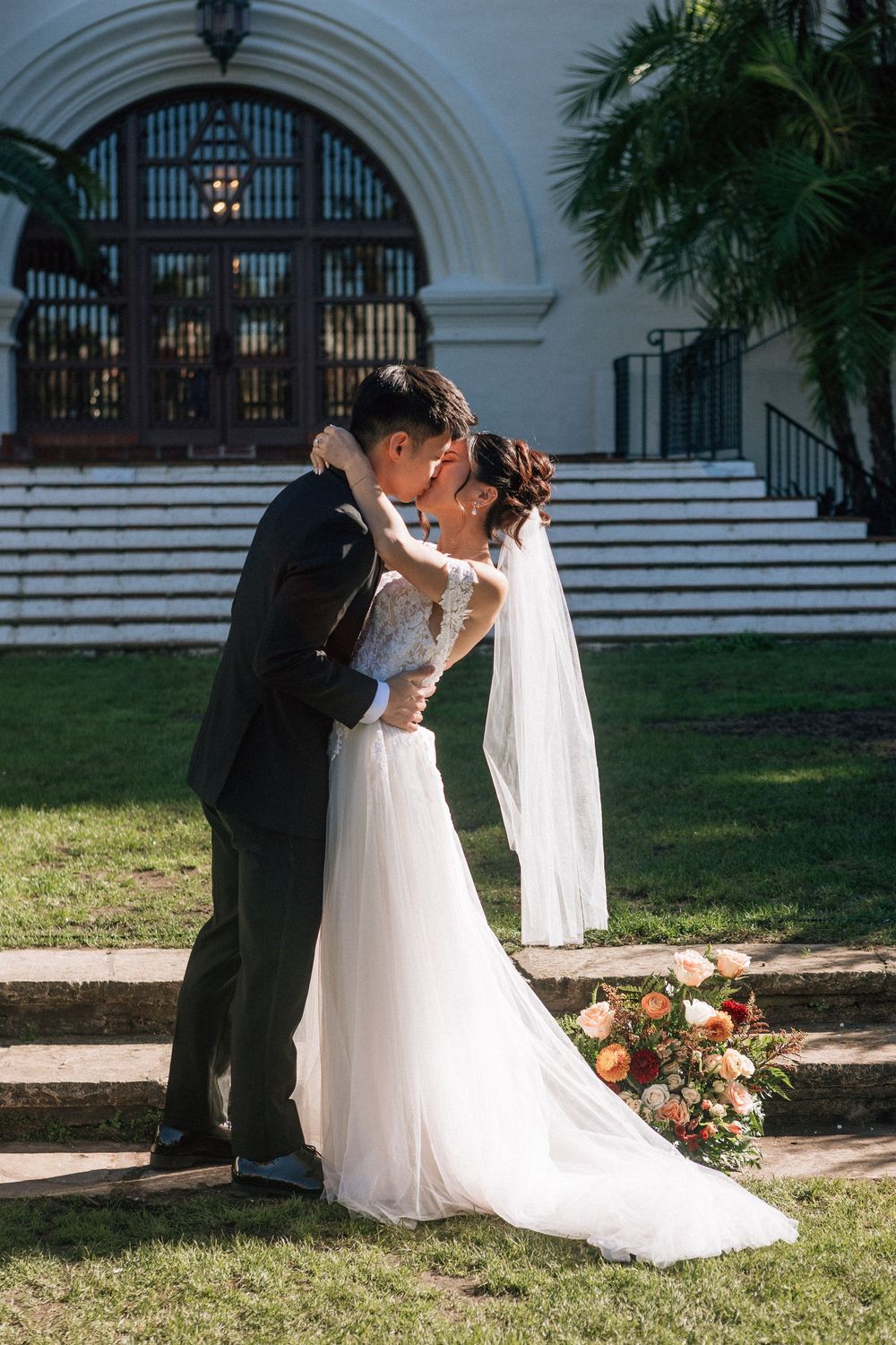 A first kiss at the Santa Barbara Courthouse wedding Sunken Gardens location