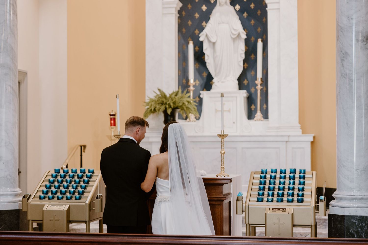 Bride and groom at altar during Sacred Heart Cathedral Catholic wedding in Knoxville, TN