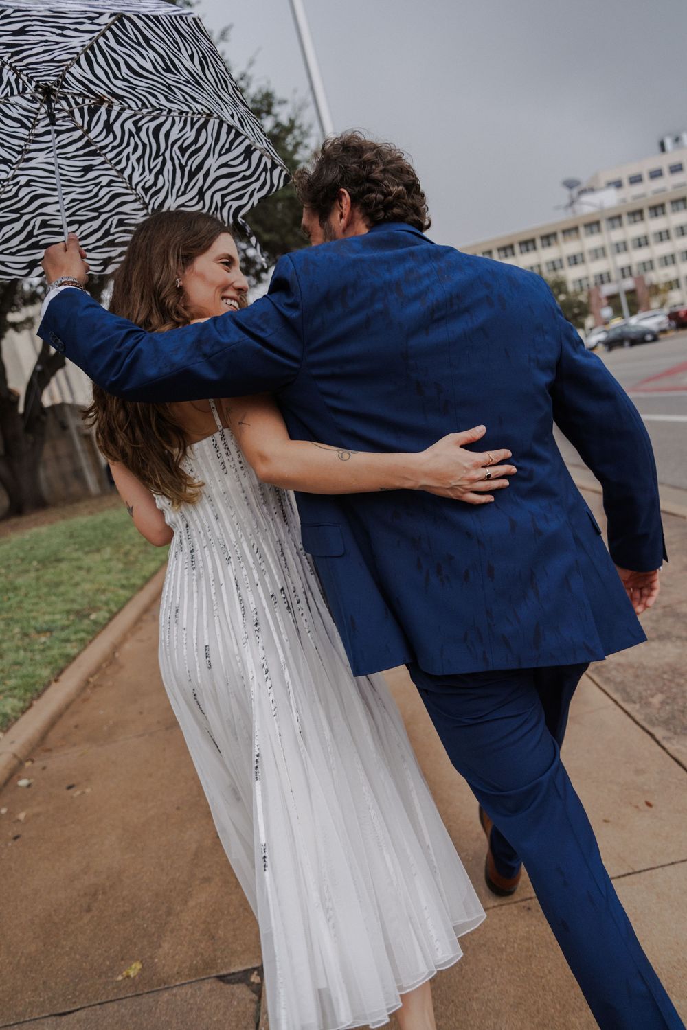 Series of candid moments between couple in wedding attire walking outdoors.