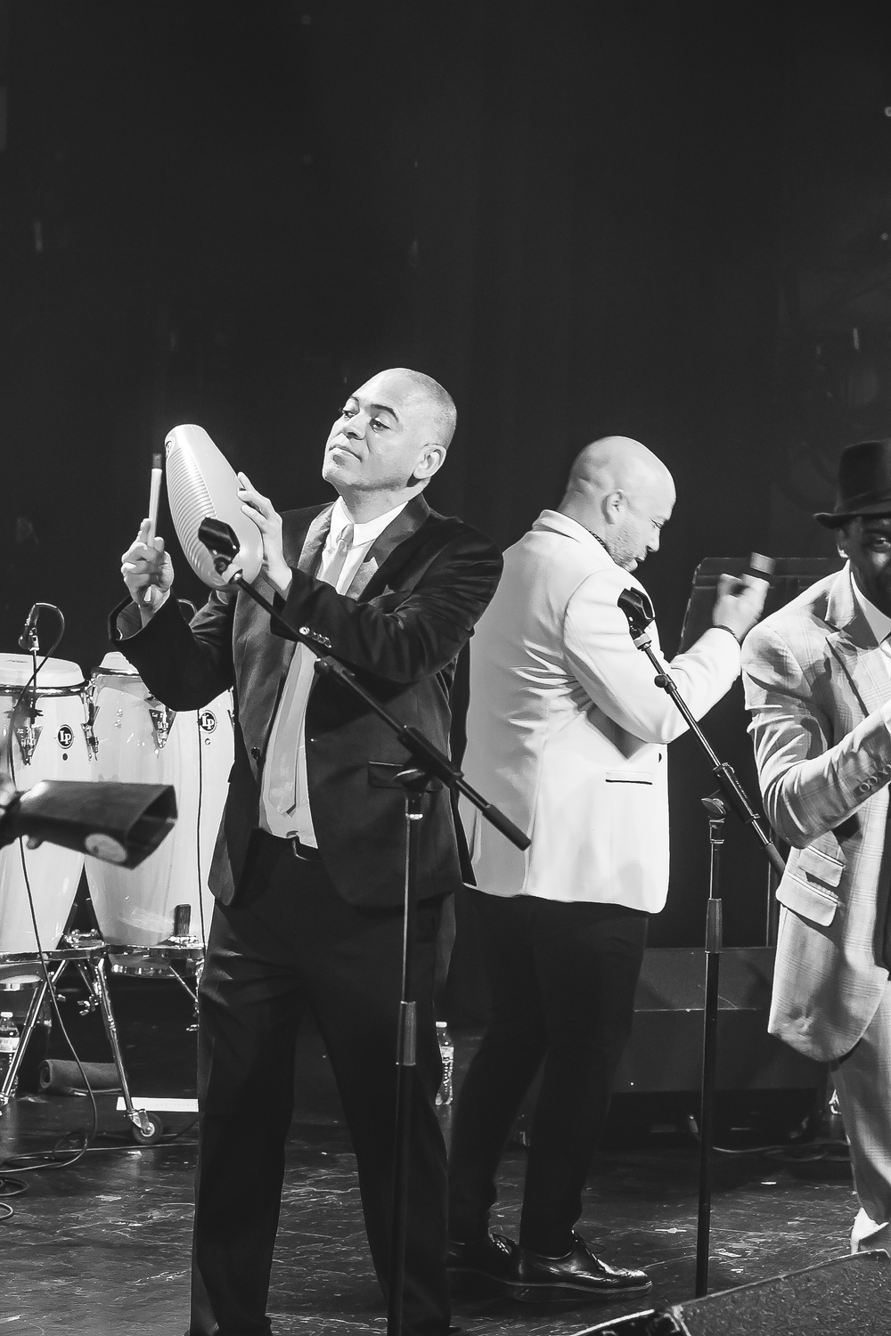 A sequence of black and white performance photos showing a gospel choir singer expressing emotion during a musical number.