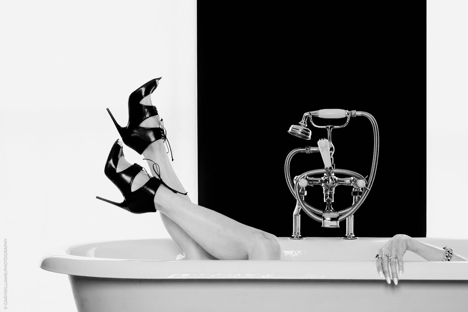 Black and white artistic photo series showing ballet dancers in graceful poses against minimalist backgrounds.