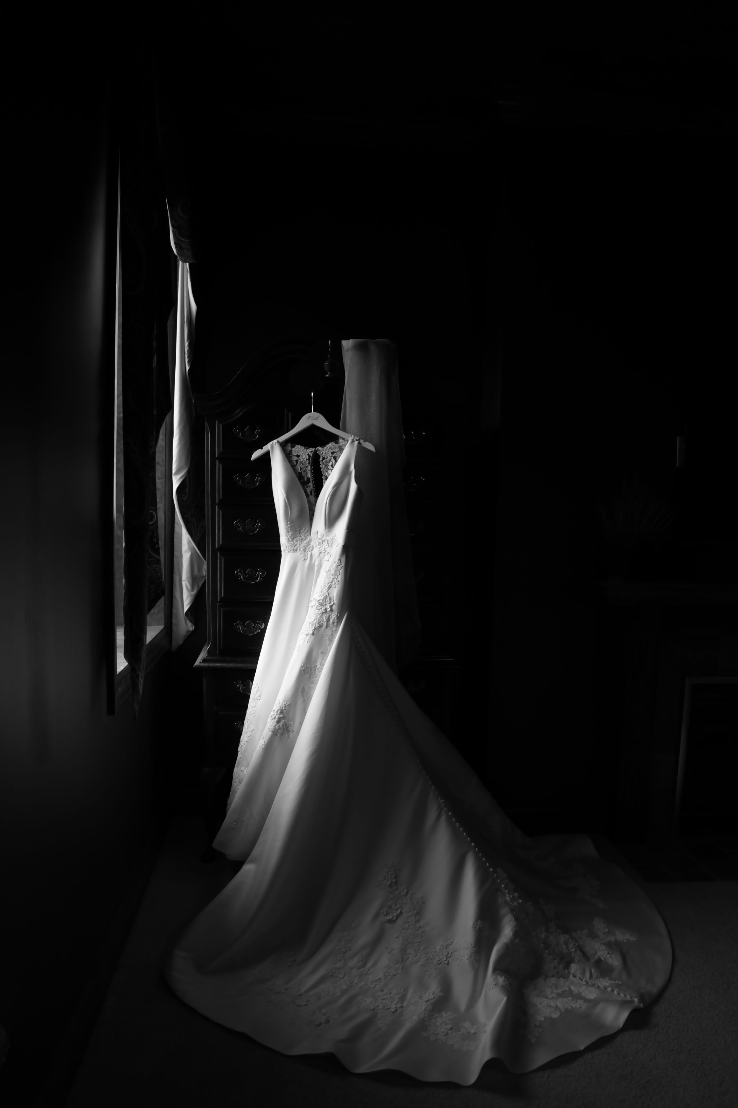 Bride's wedding dress hung by the window at the Snowhill Country Club Golf Course in New Vienna Ohio : Cincinnati Wedding Photographer