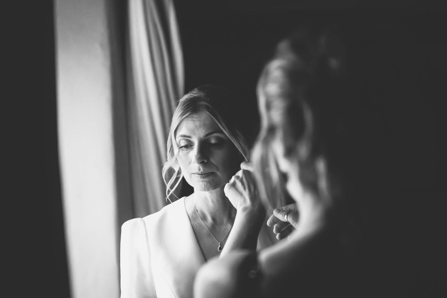 Black and white portrait sequence showing someone drinking from a coffee mug in progressive steps.