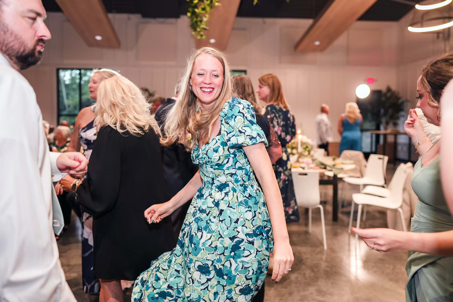 guests dance and celebrate at a lively wedding reception in Retreat 21 Wedding Venue