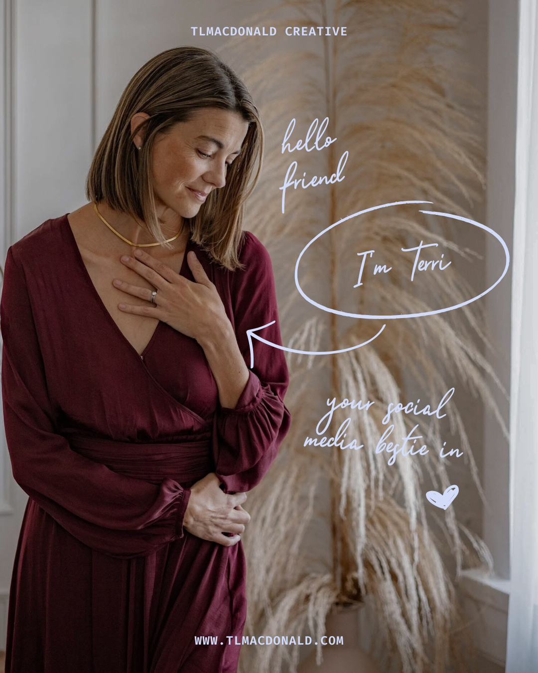 Woman in burgundy wrap dress poses against neutral backdrop in moody lifestyle photography series.