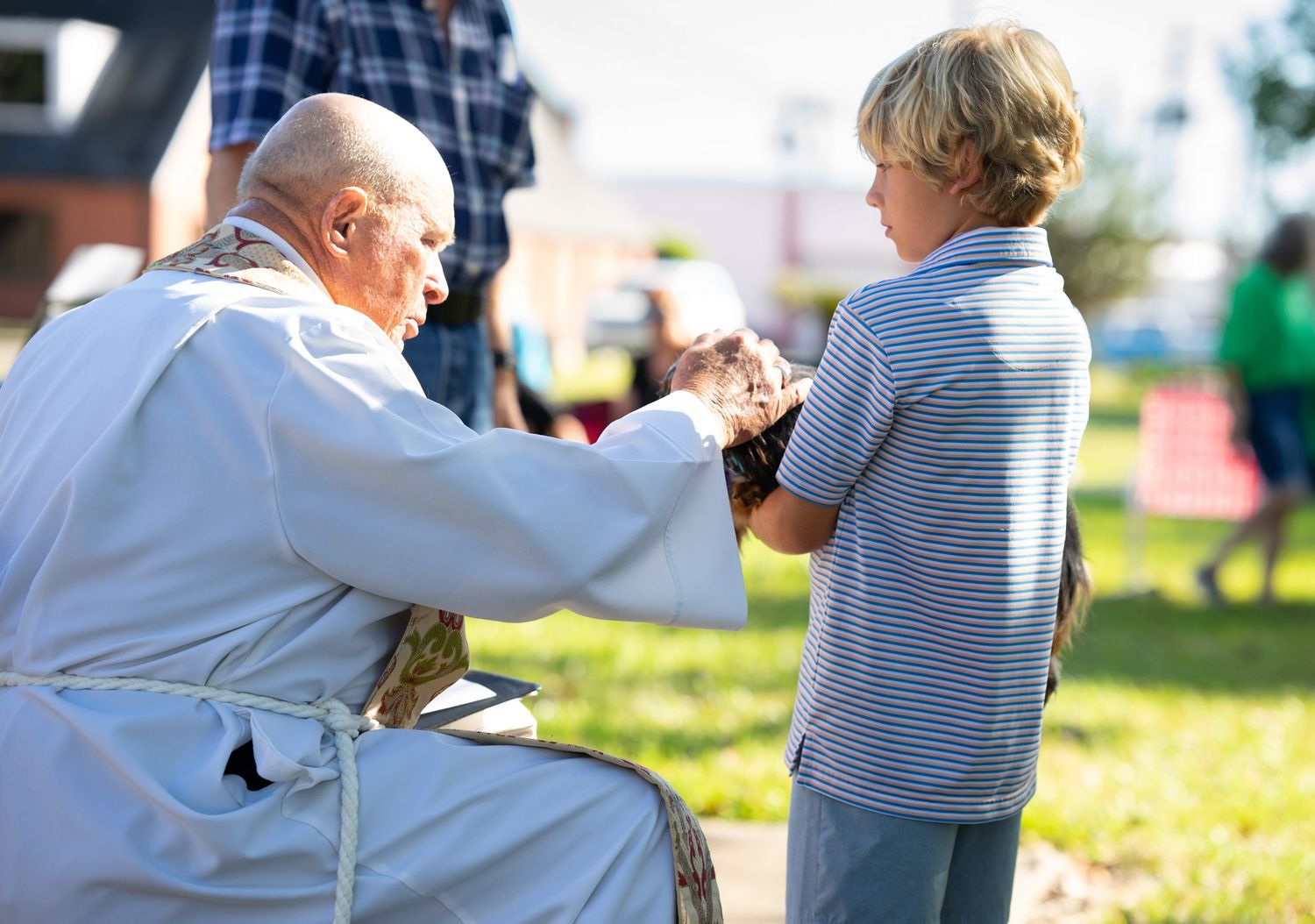 Candid capture during branding session of a church during the blessing of the pets service.