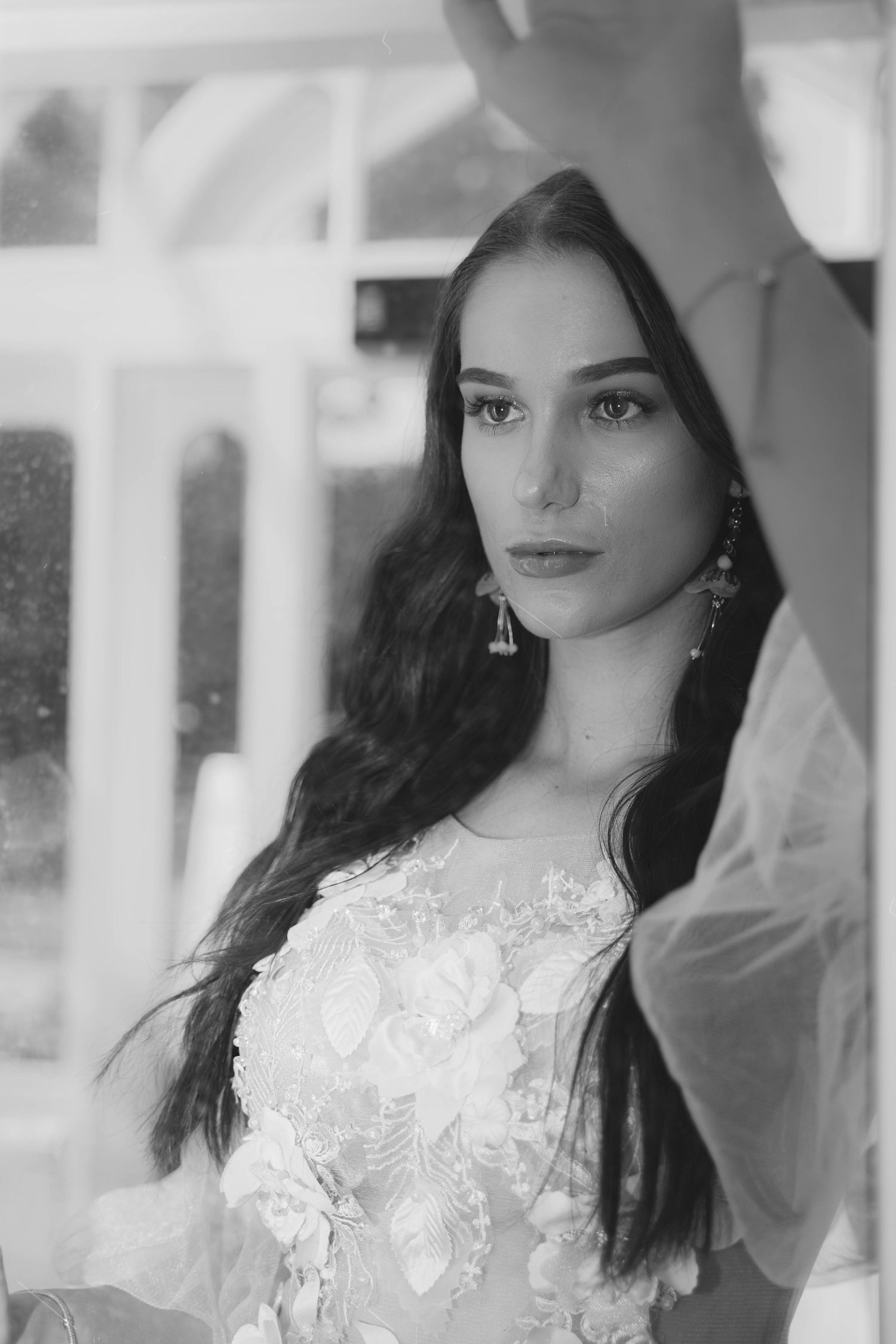 A candid series of progressive portrait shots shows a person in a black top with elegant lighting.