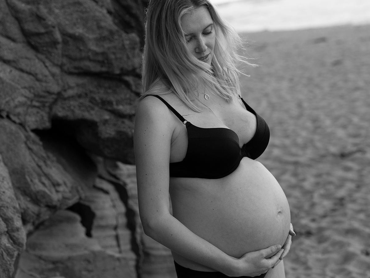 A series of black and white maternity photos showing a pregnant woman's silhouette against a natural backdrop.