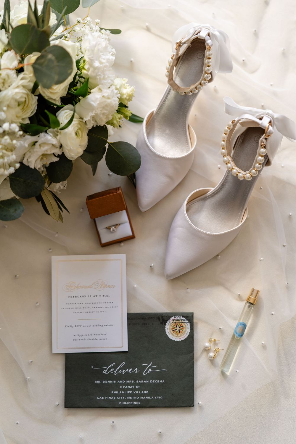 Elegant bridal flat lay with pearl heels and wedding details at The Saphire Estate