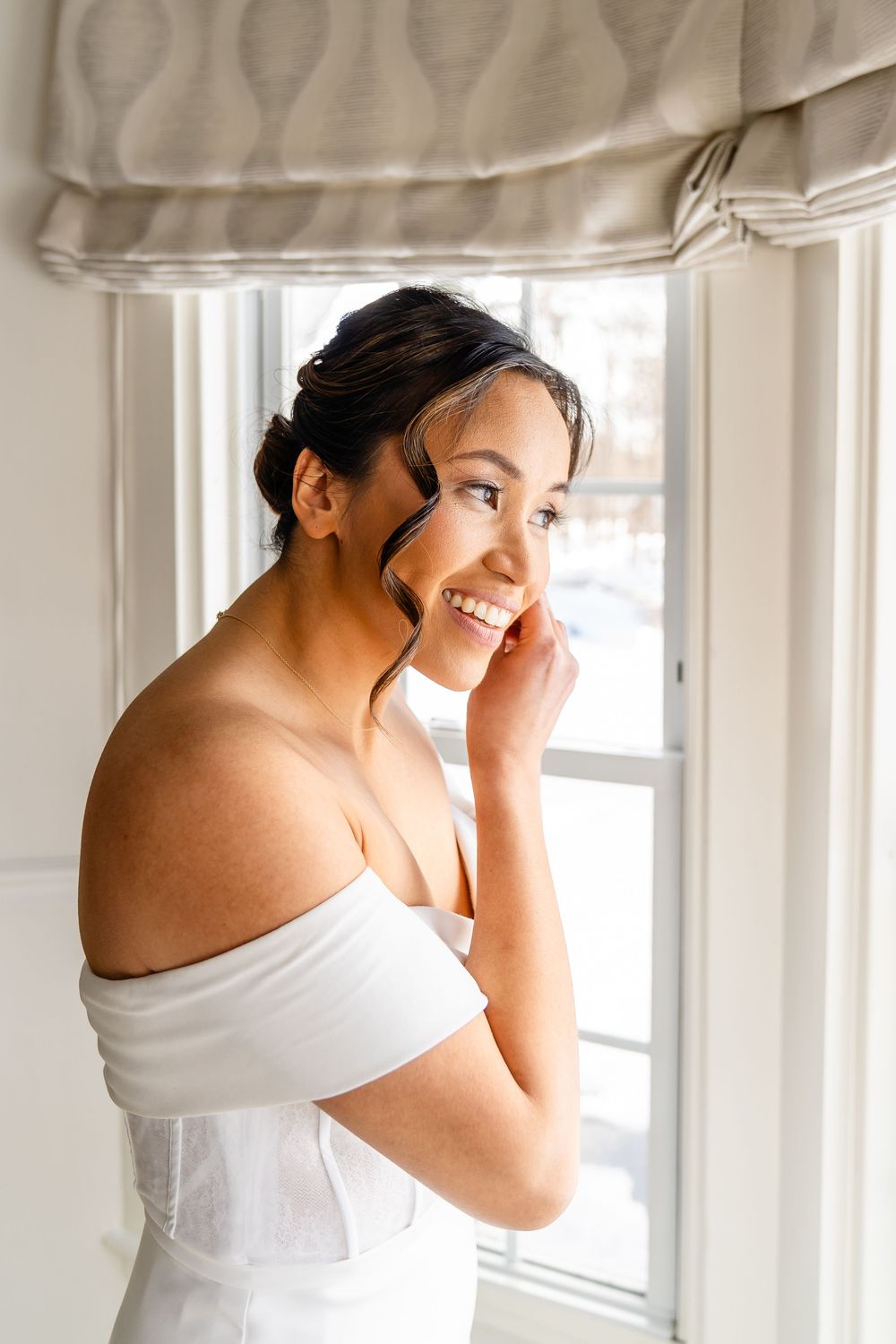 Smiling bride preparing for wedding ceremony at The Saphire Estate