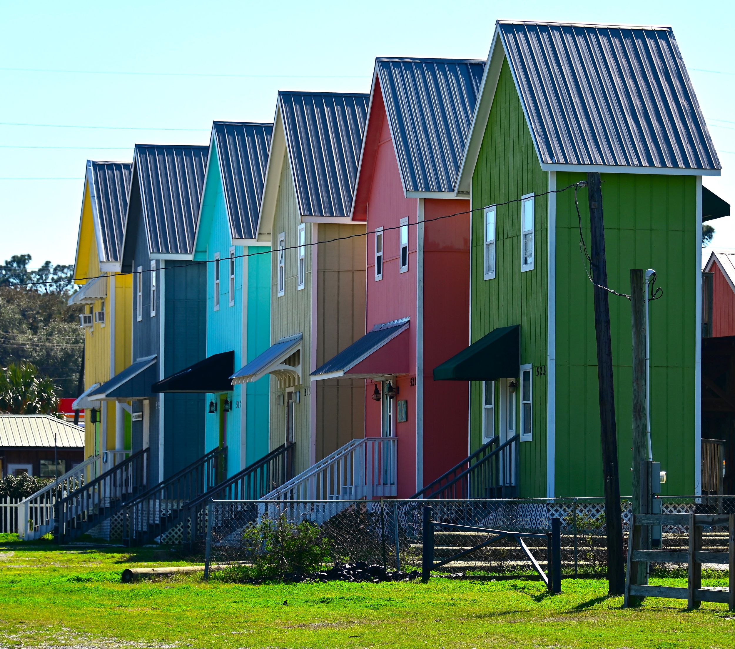 Colorful shotgun style beach houses on Dauphin Island Alabama Gulf Coast