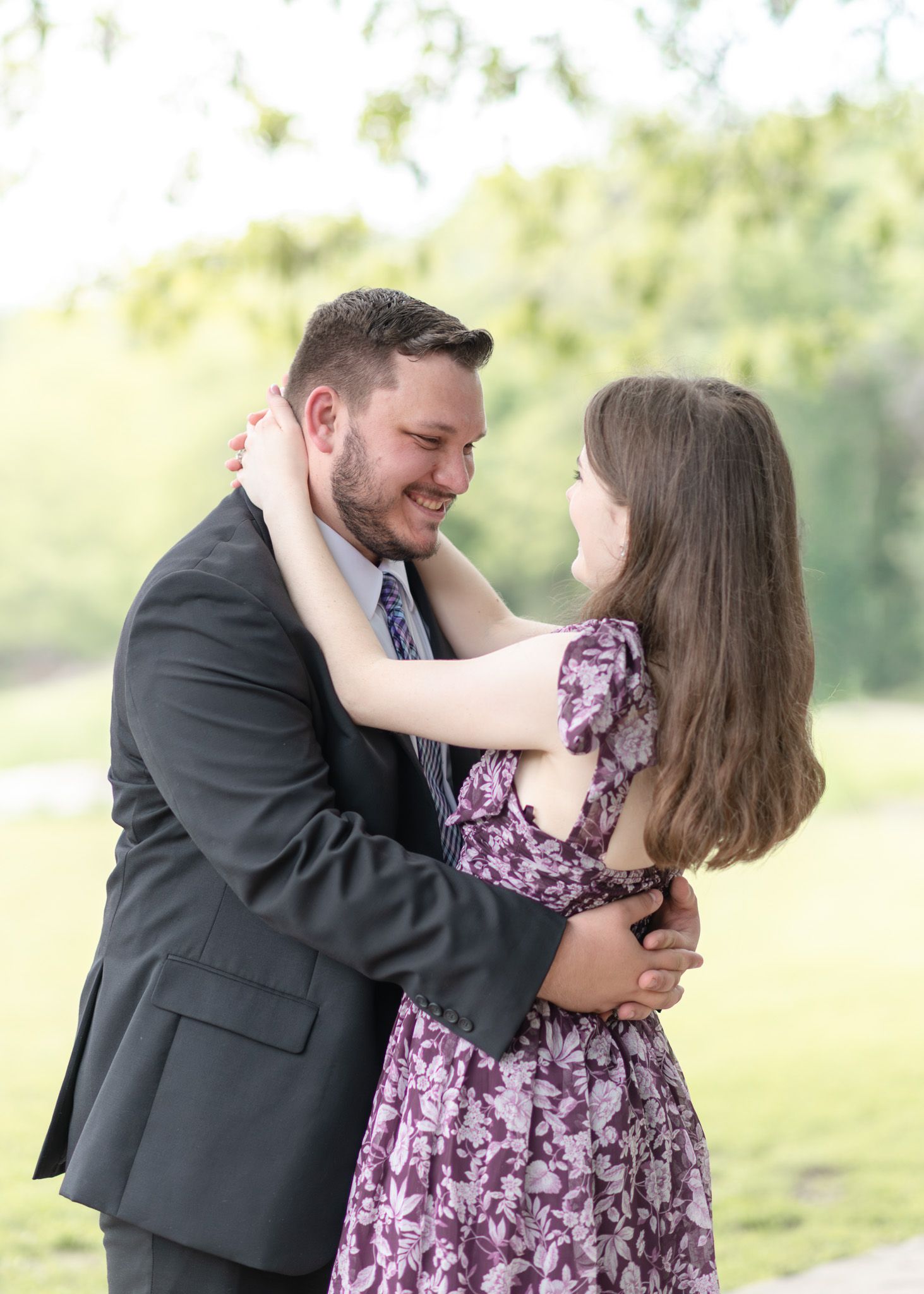 Engaged couple sharing a moment during golden hour session at Nolan Creek Trail in Temple Texas