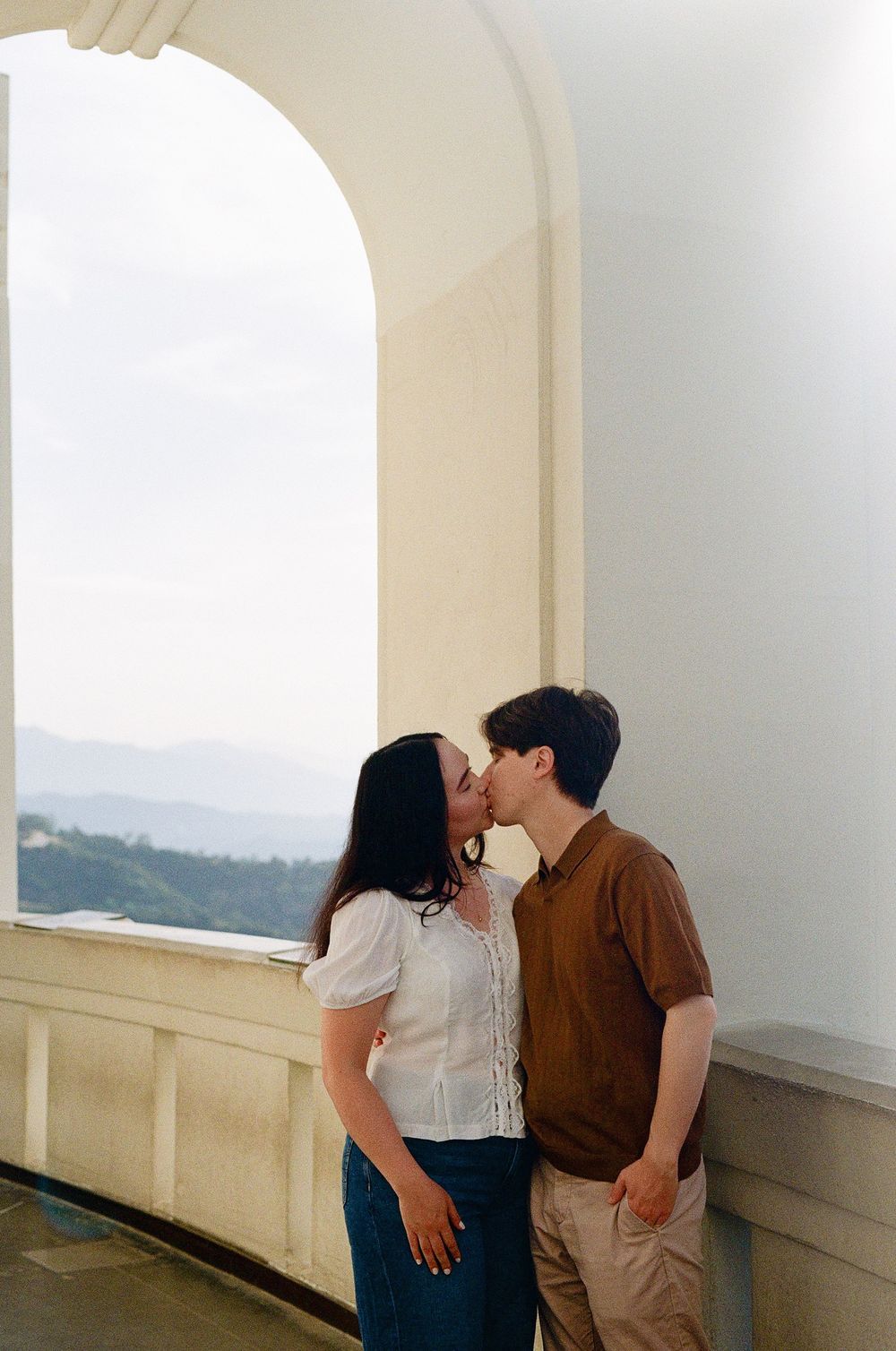 Chill, documentary-style engagement session at Griffith Observatory, featuring 10 years of hybrid film experience for NC
