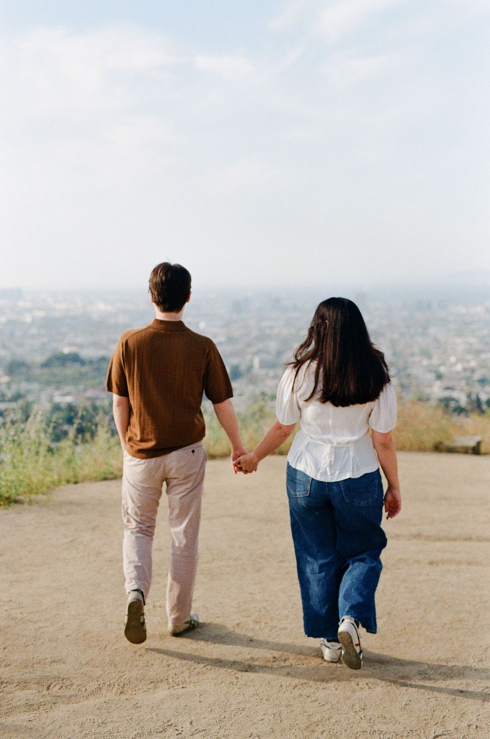Chill, documentary-style engagement session at Griffith Observatory, featuring 10 years of hybrid film experience for Carolina couples.