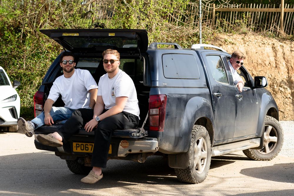 Groom and groomsmen chilling in the spring sunshine at Nancarrow Farm in Cornwall