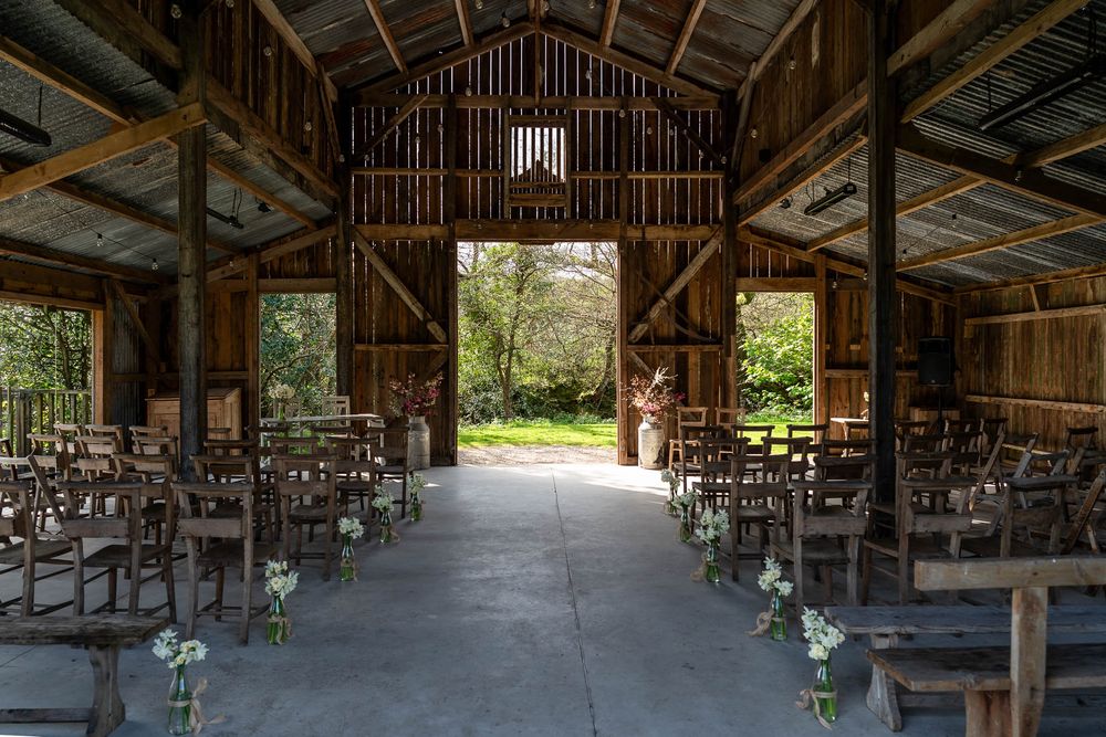 Cornish rustic Barn set up for ceremony at Nancarrow Farm Weddings