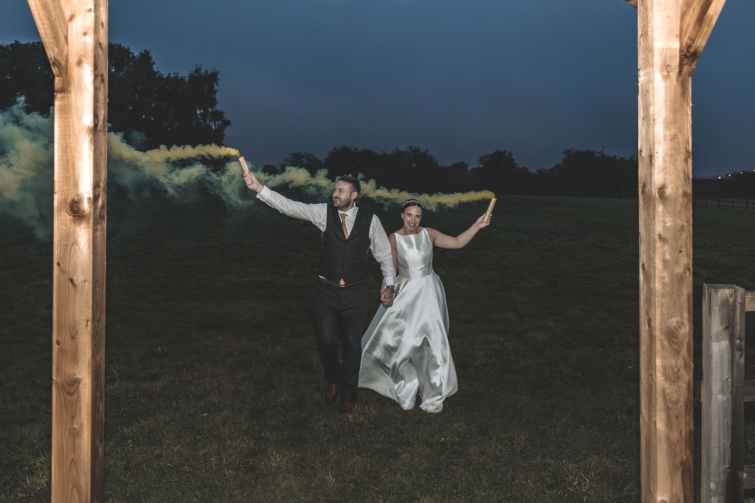 Relaxed couple portrait photo on an evening with some smoke bombs.