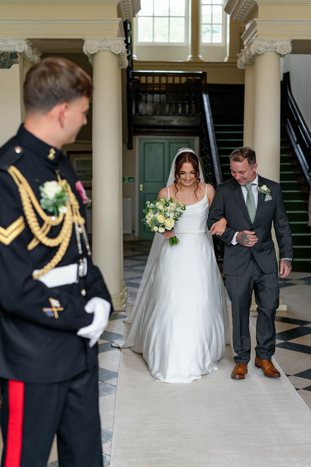 Bride walking down Isle with Father at Crowcombe Court