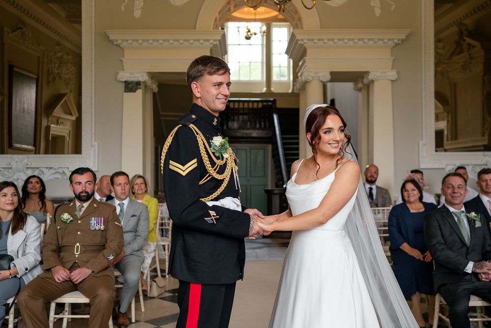 Bride and military Groom during ceremony at Crowcombe Court