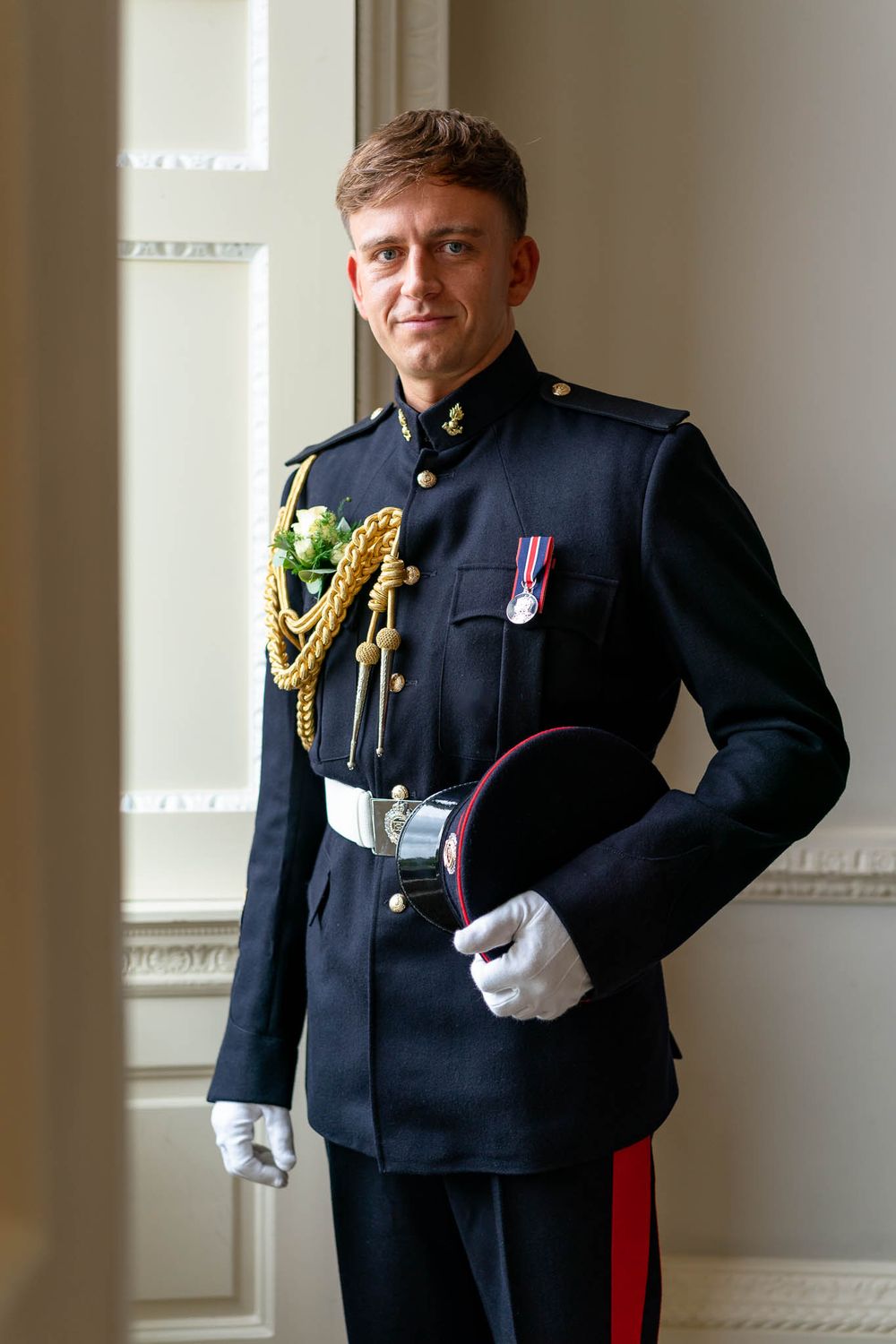 Groom portrait in military uniform at Crowcombe Court in Somerset