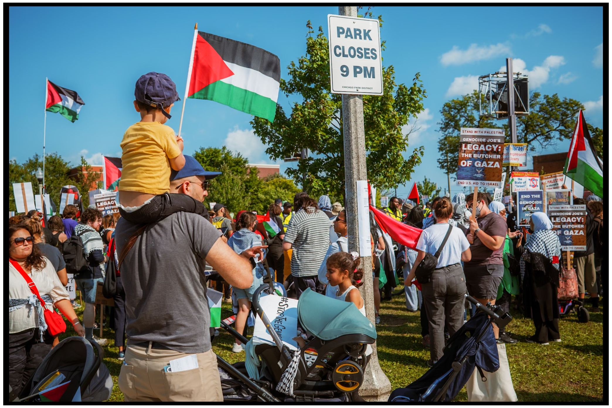 Person standing in park wearing t-shirt with architectural image. Chicago. March on DNC