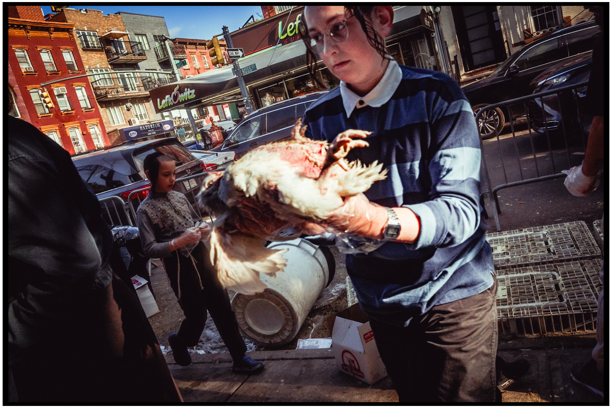 Orthodox Jewish community members practicing kapparot. Brooklyn, nyc.