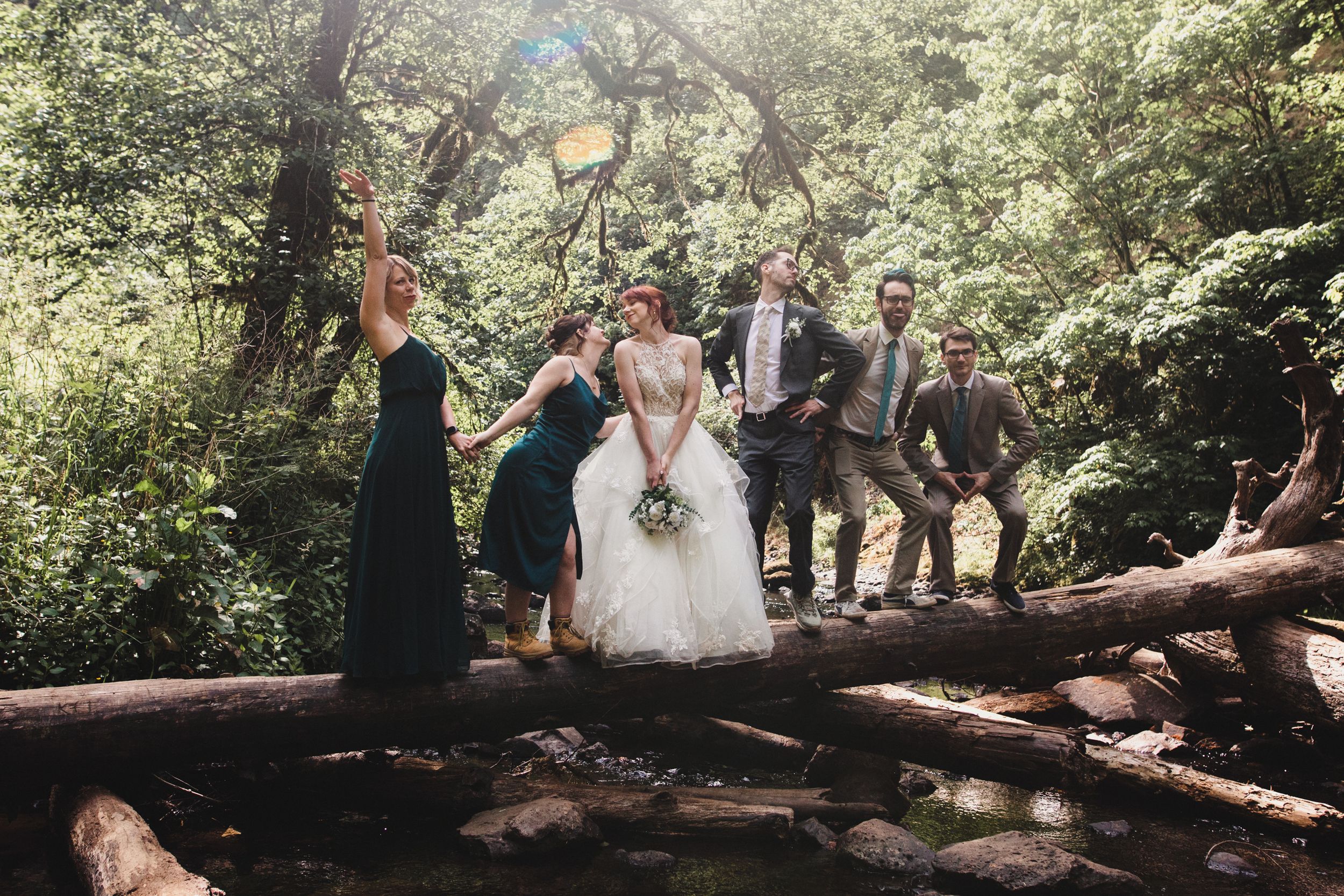 A sequence of intimate outdoor forest wedding moments captured in natural light beneath towering trees in a woodland setting.
