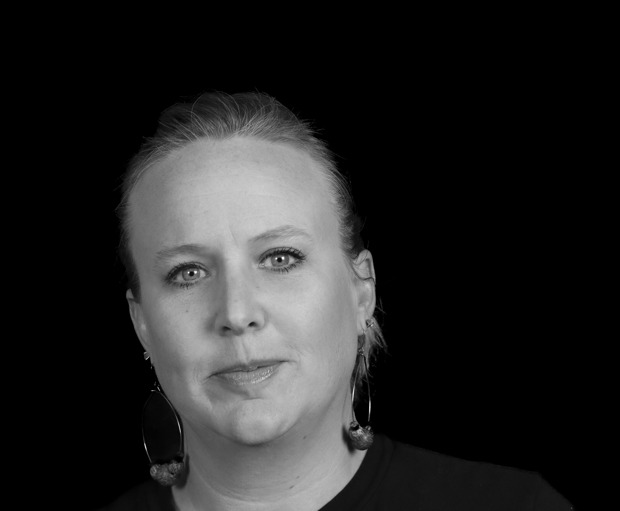 A series of black and white headshots arranged horizontally showing different facial expressions and poses.