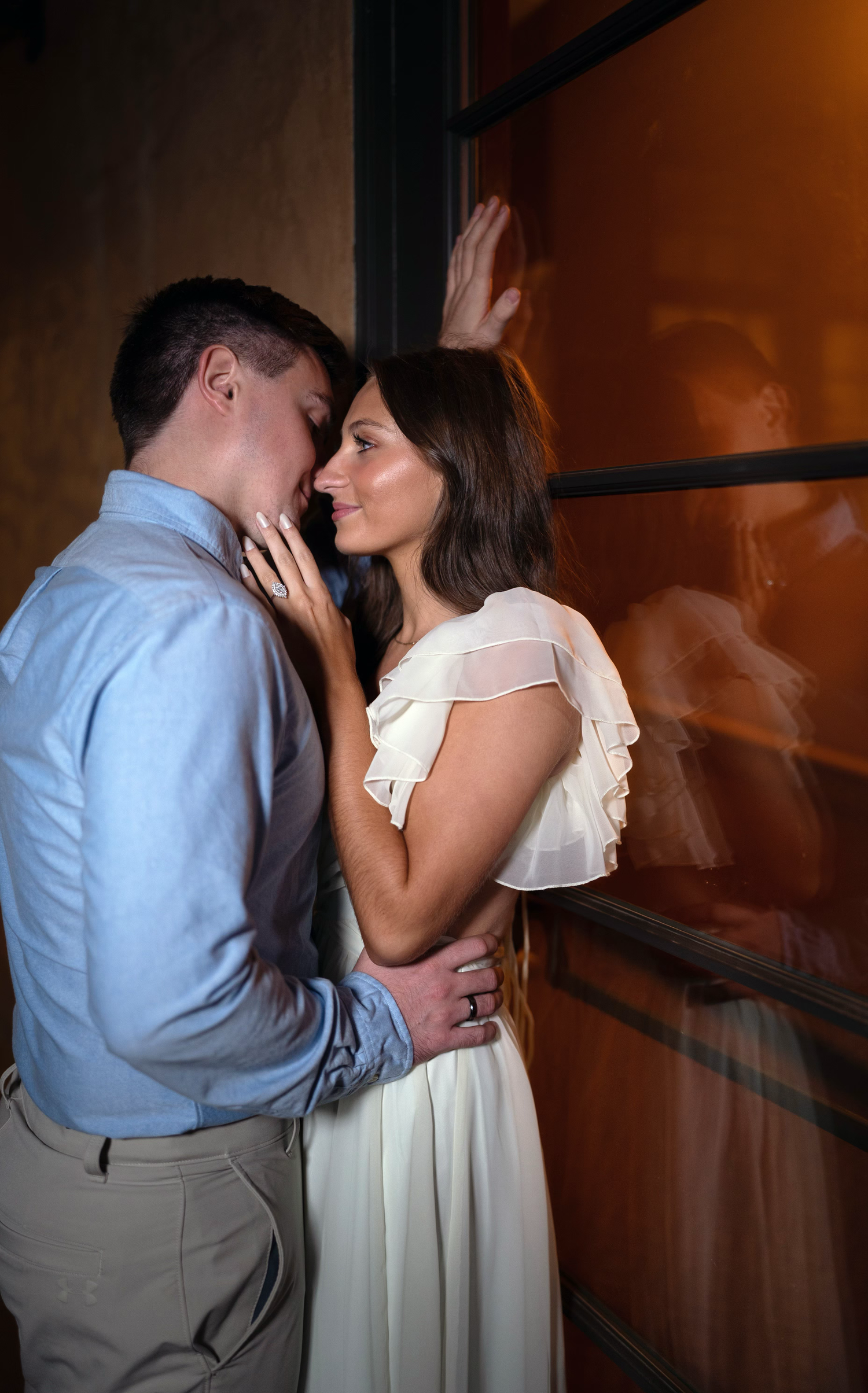 Romantic couple sharing an intimate moment for their engagement photo