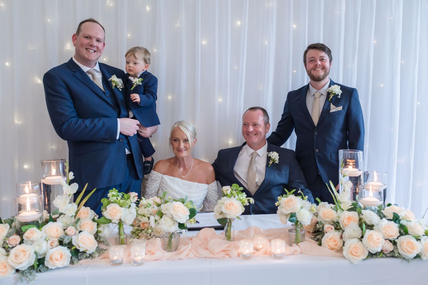 The bride and groom with family after signing the marriage register at De Vere Cranage Estate; Classic wedding photography by Michael Pardoe