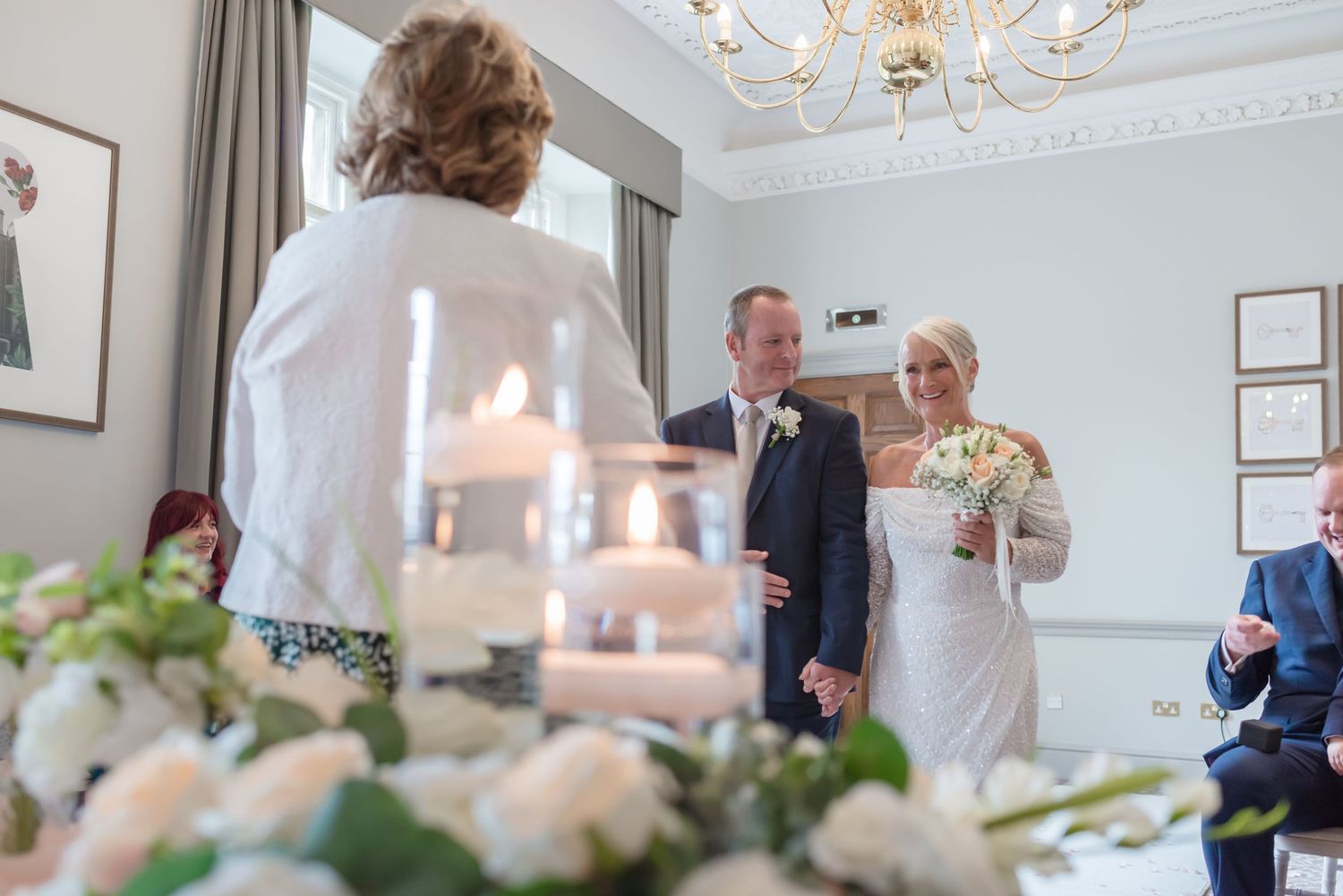 Romantic candlelit wedding ceremony decor at De Vere Cranage Estate; elegant Cheshire wedding venue styling captured by Michael Pardoe.