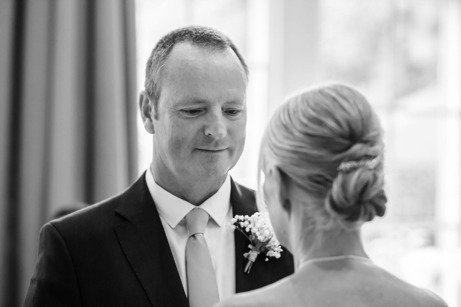 Bride and groom sharing an emotional moment during their ceremony at De Vere Cranage Estate, Holmes Chapel;  by Michael Pardoe, photographer