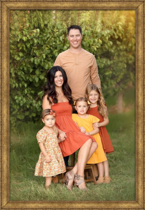 Las Vegas Family Photographer creating fine art portraits for families in a green orchard in Las Vegas.  Best Las Vegas Family Photography.