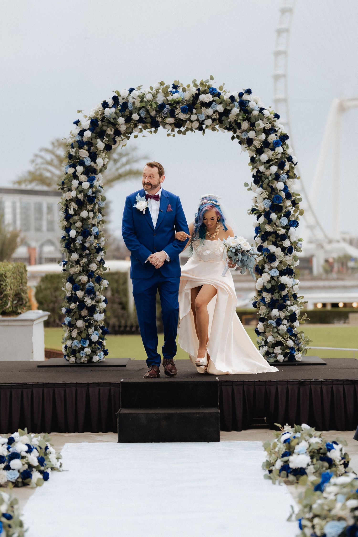Elegant bride and groom portrait inside grand architectural colonnade in Abu Dhabi