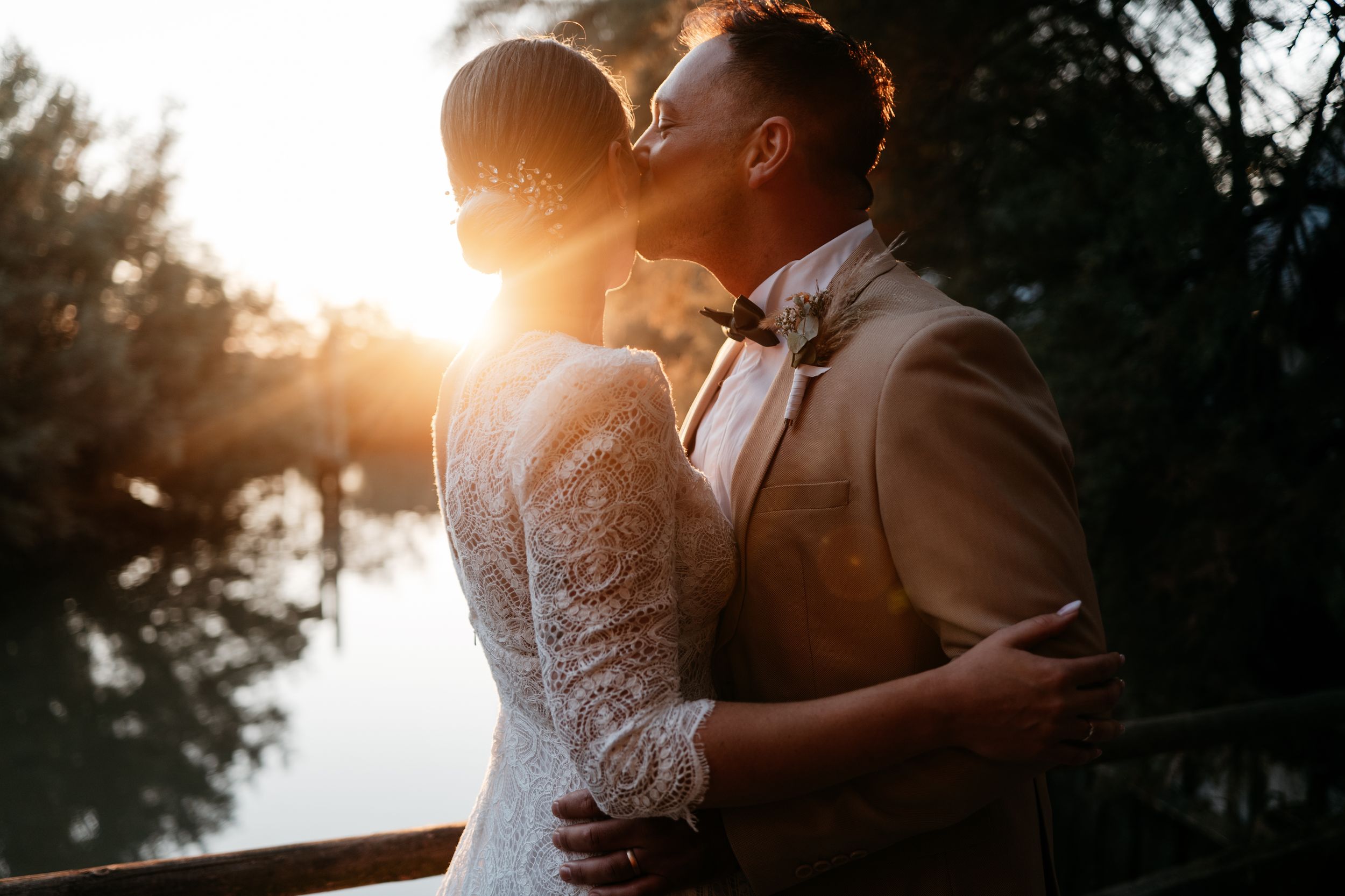 A series of black and white wedding photos showing bridal details including veils, gowns and romantic moments.