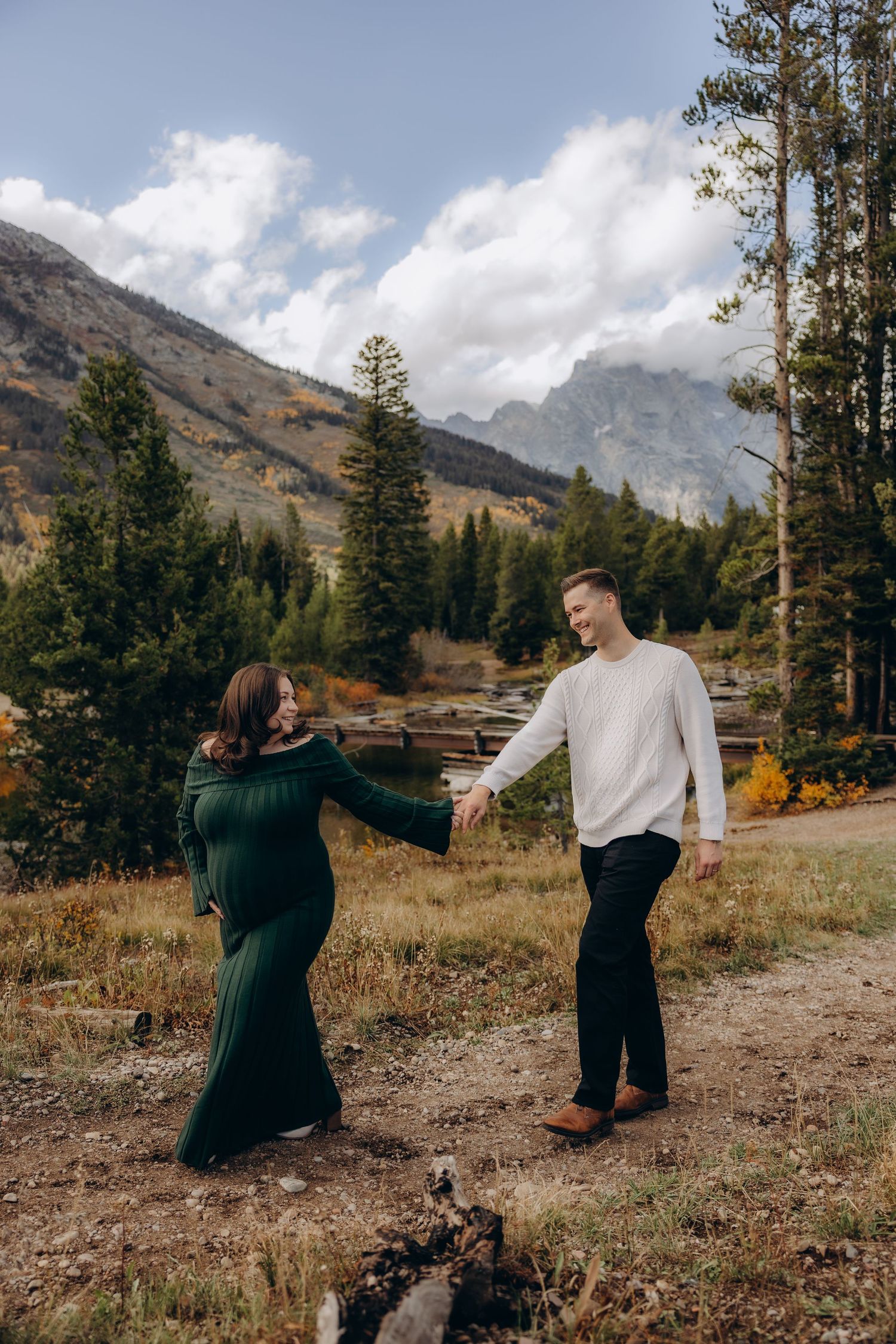 A playful sequence of photos showing a couple in a scenic mountain landscape with evergreen trees and autumn colors.