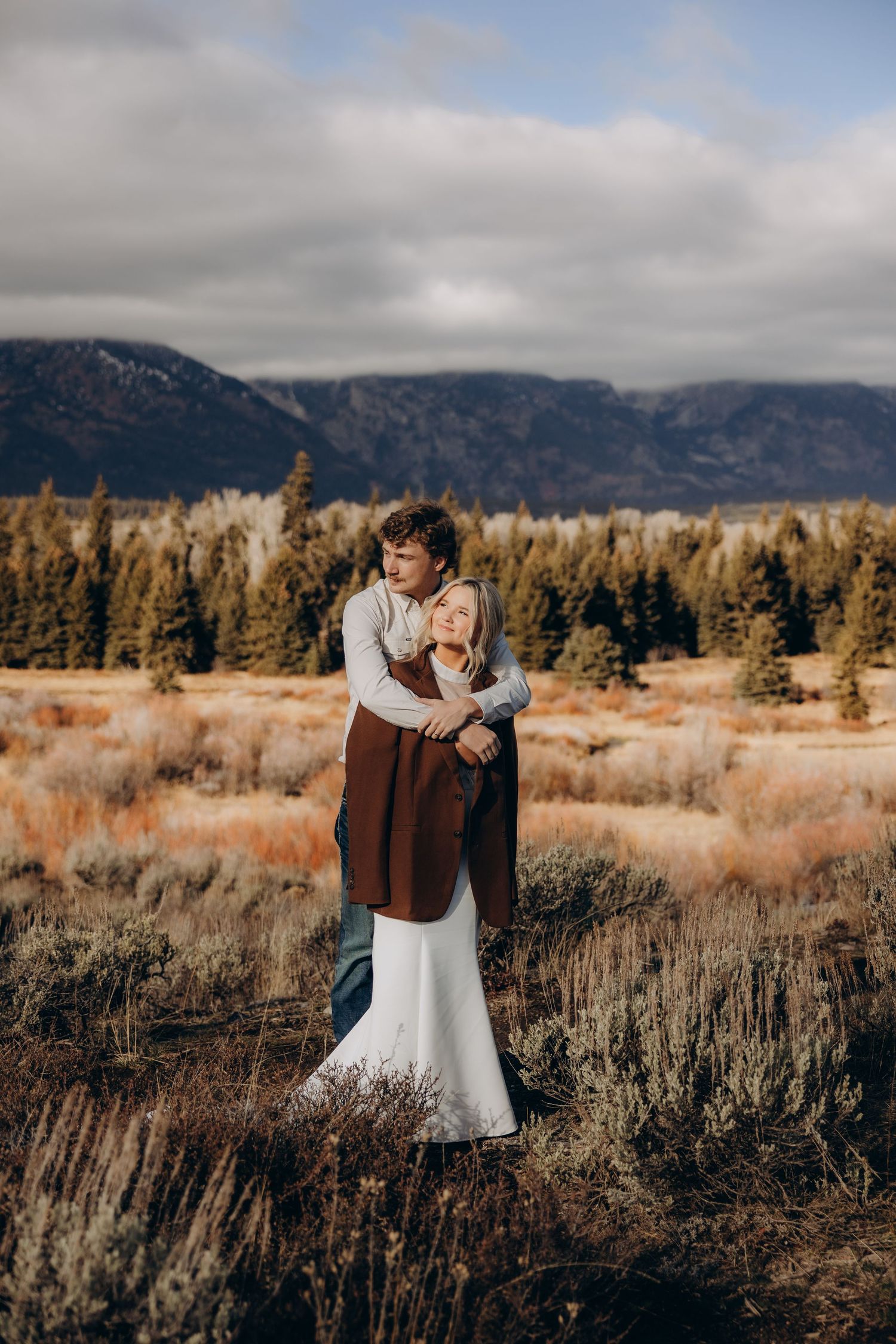 A romantic wedding photoshoot sequence at a rustic wooden cabin showing intimate moments between a couple in sunlight.