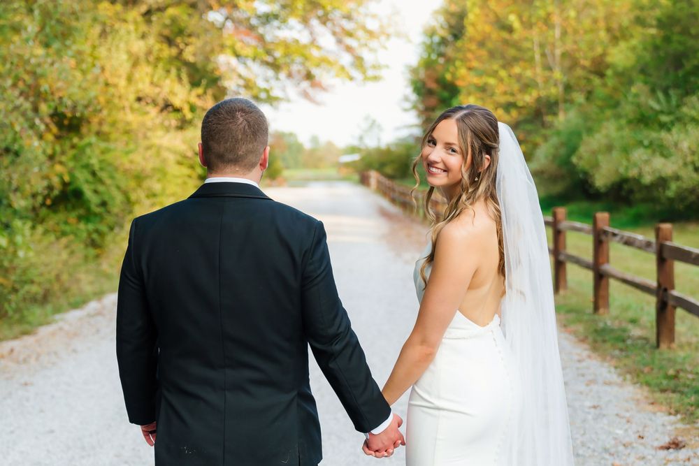 Bride and Groom couple's portraits walking holding hands at The Venue On Lake Grant in Mt. Orab Ohio : Cincinnati wedding photographer