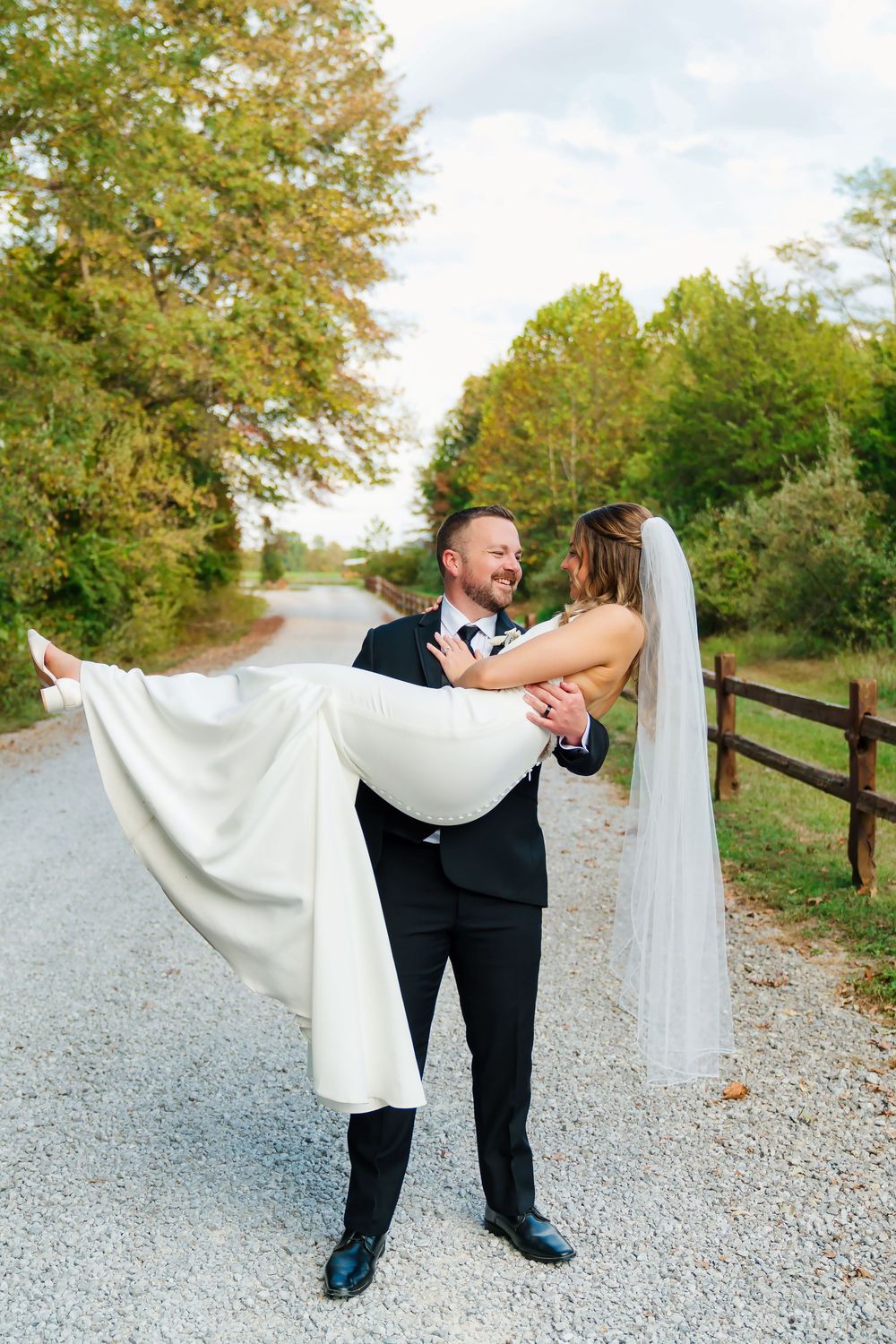 Bride & Groom couple's portraits with the groom holding the bride at The Venue On Lake Grant In Mt Orab OH. Cincinnati wedding photographer