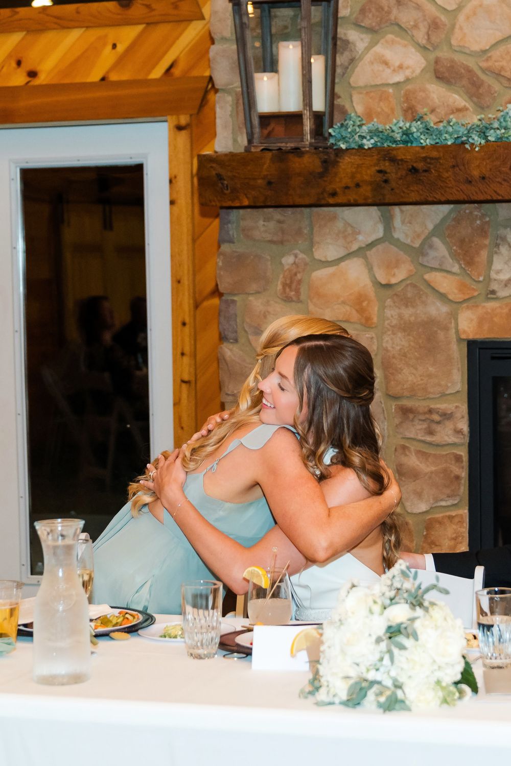 Bride and Maid of Honor hugging after the maid of honor gave her toast at The Venue On Lake Grant in Mt. Orab Ohio. Cincinnati Ohio