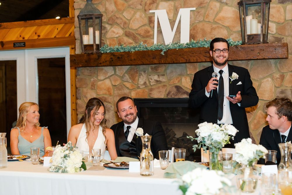 Bride and Groom laughing during the Best Man's speech at The Venue On Lake Grant in Mt. Orab Ohio : Cincinnati Ohio wedding photographer