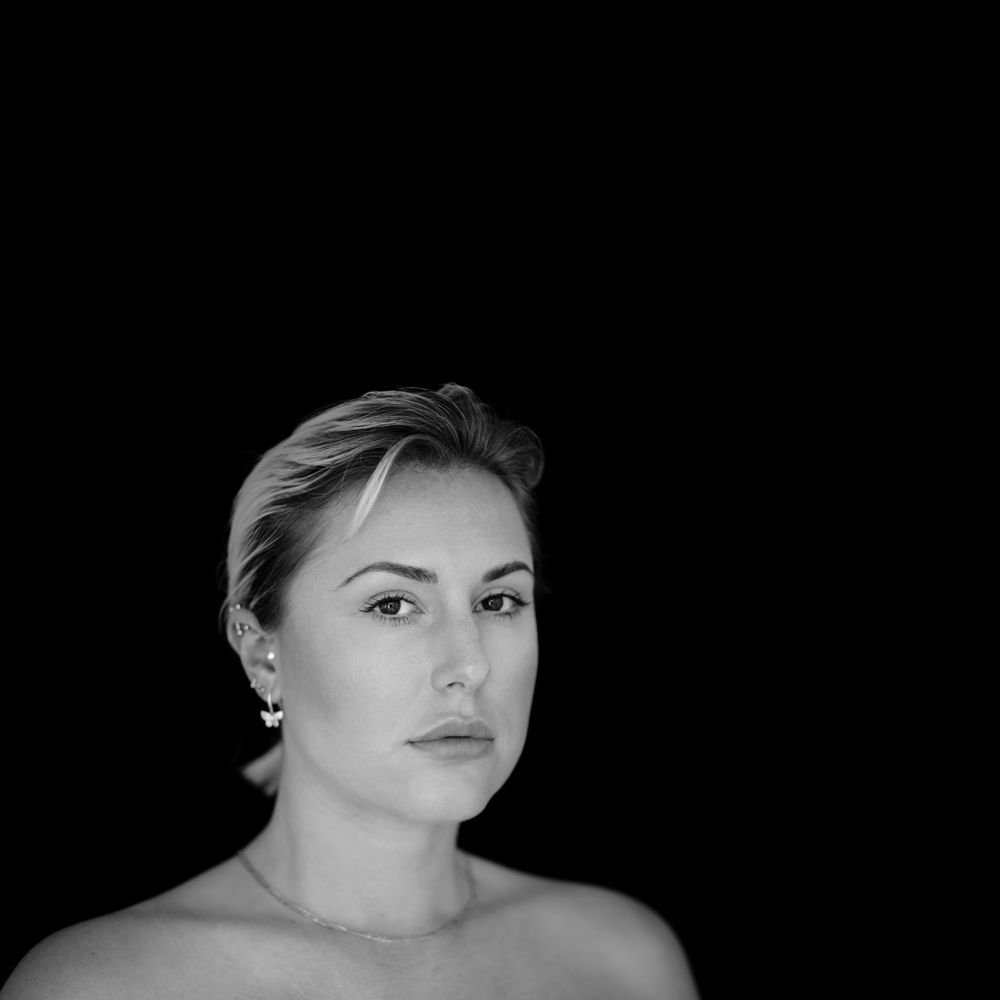 headshot of a lady in ross on wye with bare shoulders