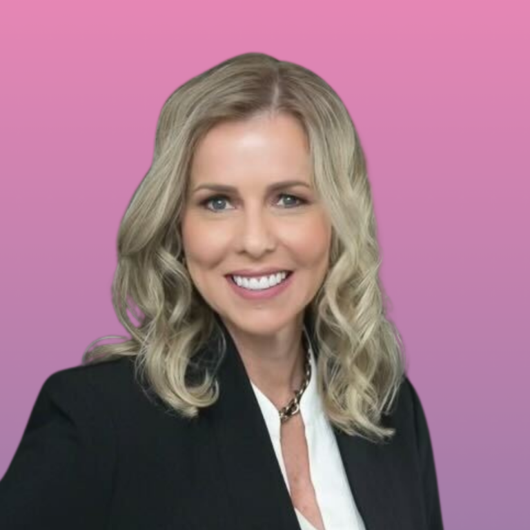 Professional headshot of a person with blonde wavy hair wearing a black blazer against a pink background.