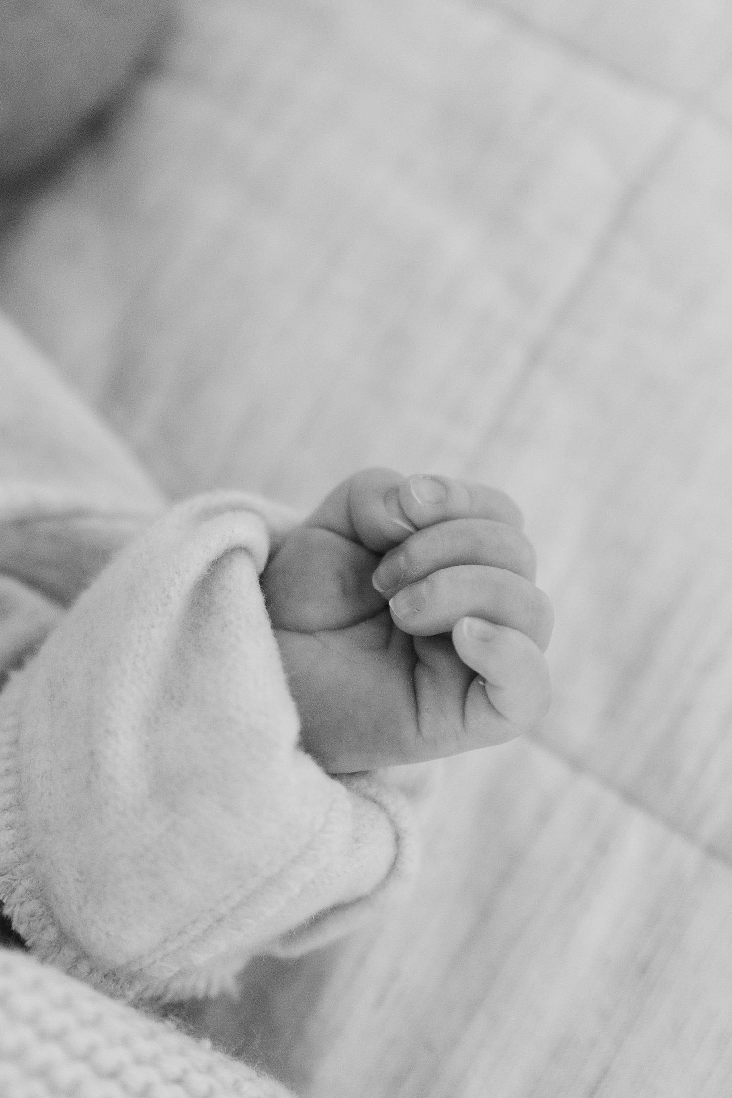 b&w close up of baby fingers