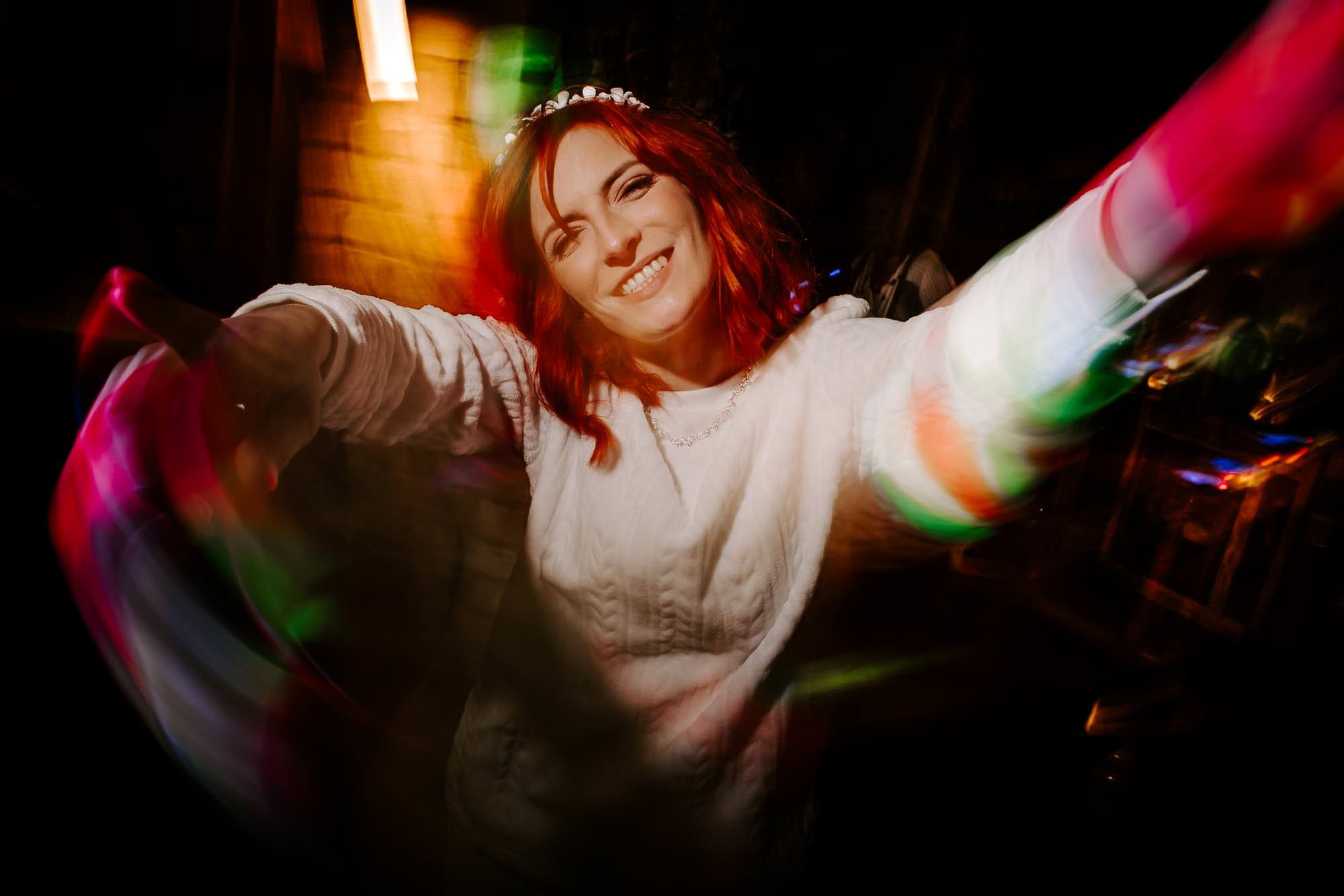 Colorful nightclub scene with dynamic lighting and motion blur effects creating an energetic party atmosphere.