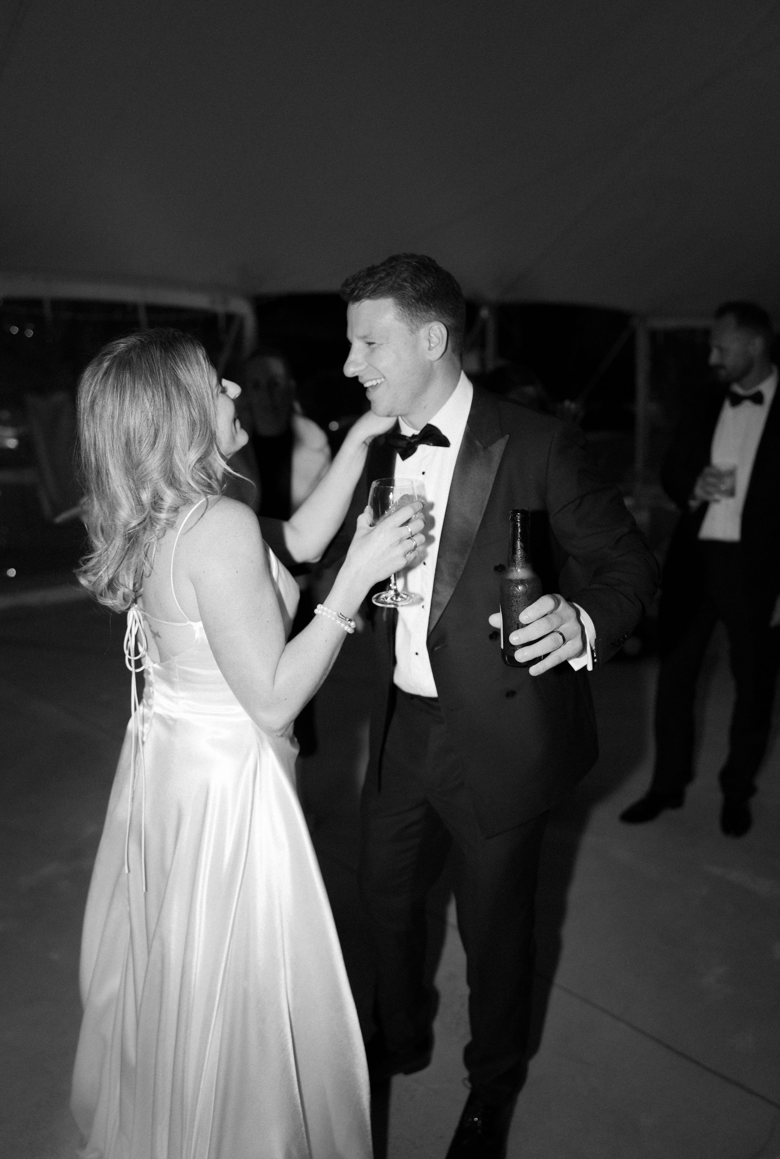 Black and white photos show a couple dancing together at a formal event, with the woman wearing a flowing white dress.