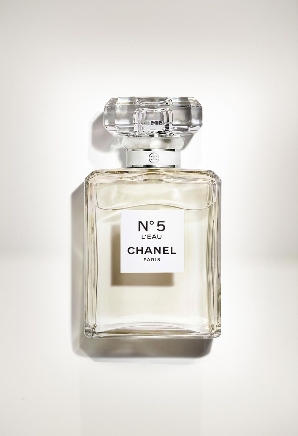 Chanel No. 5 L'Eau perfume bottle photographed against clean white background with soft shadow.