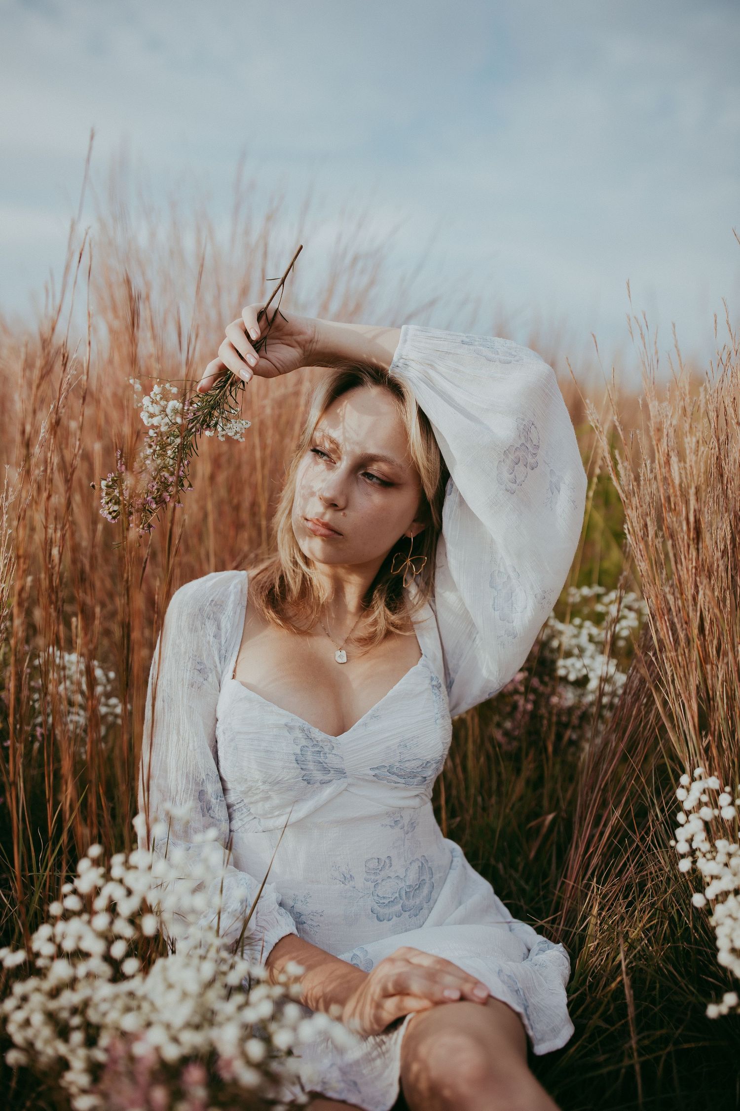 Kansas senior portrait session photographed in an open field with soft, natural tones